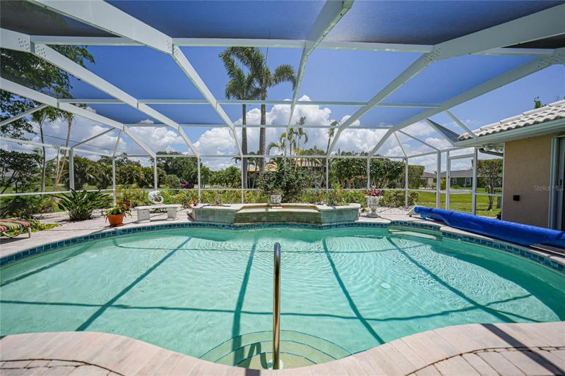 Heated pool with beautiful surroundings and landscaping.