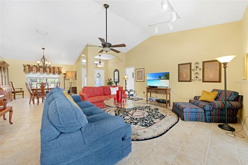 Vaulted ceilings and the open floor plan makes this space feel much larger!