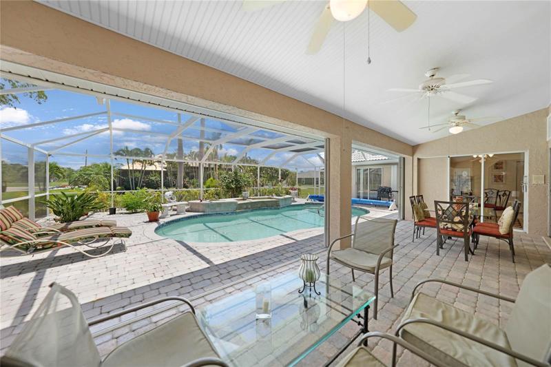 Enjoy easy access to the lanai and pool right from your Master Bedroom.