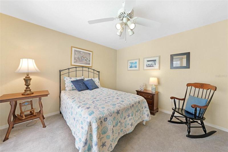 Lots of natural sunlight brightens this guest bedroom.