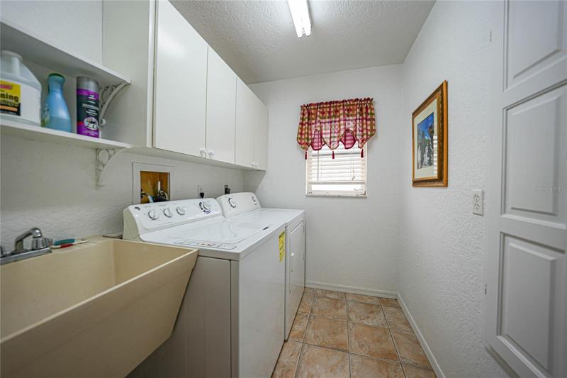 Perfect laundry room complete with w/d (that does convey), utility sink plus lots of storage!