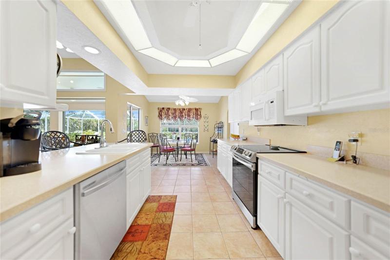 Light and cheery, the galley kitchen is easily accessible from the Living and Dining rooms from either end.