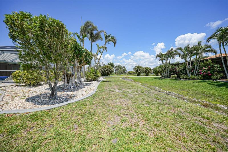 Behind home. Neighbor's landscaping adds to your privacy.