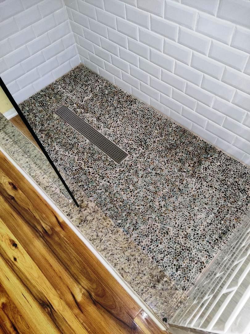 Beautiful floors. Wood throughout, hand pick sea pebble in owner's suite shower.