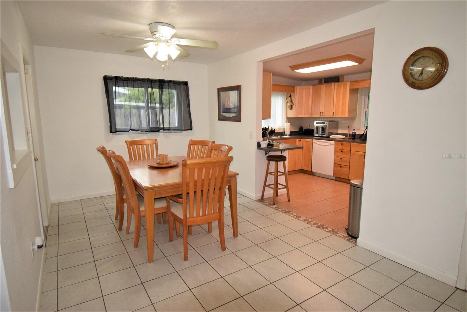 Dining area directly off the kitchen allow for ease of serving family and guests.