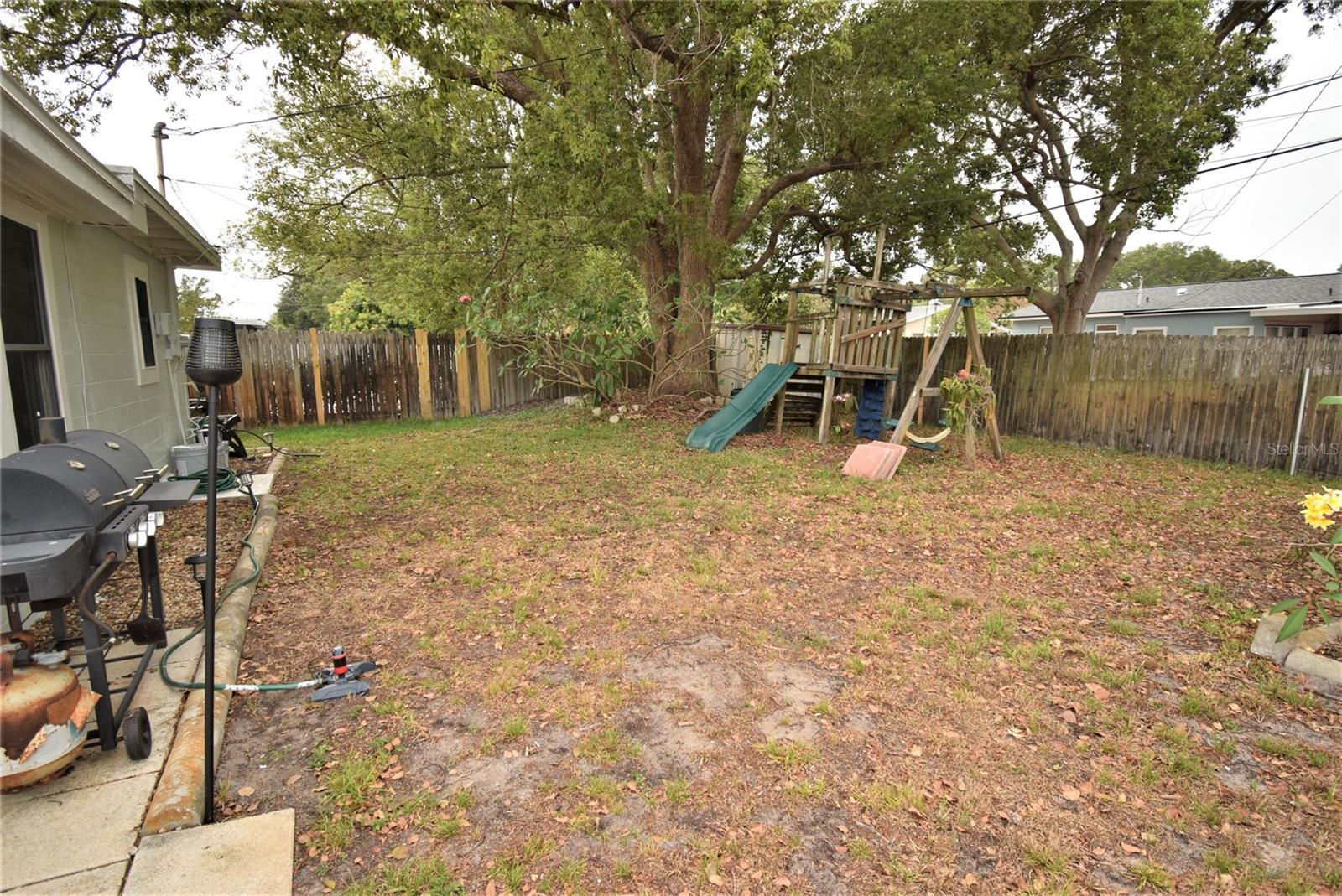 Very spacious and partially shaded backyard.