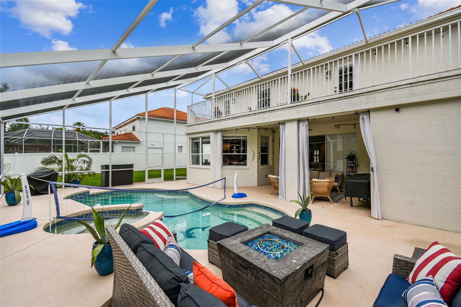 2 story lanai with back patio on the first floor and second story deck