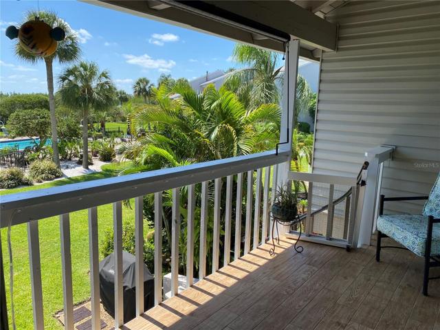 Covered balcony off living room overlooks the pool, grounds and your boatslip. Watch sunrise and the after glow of sunsets.