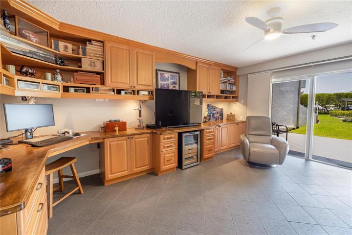 Bonus room has tile floors, built in cabinets and desk