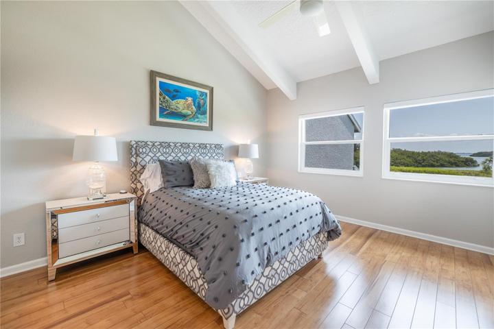 Owner's suite with vaulted ceiling, wood luxury vinyl flooring