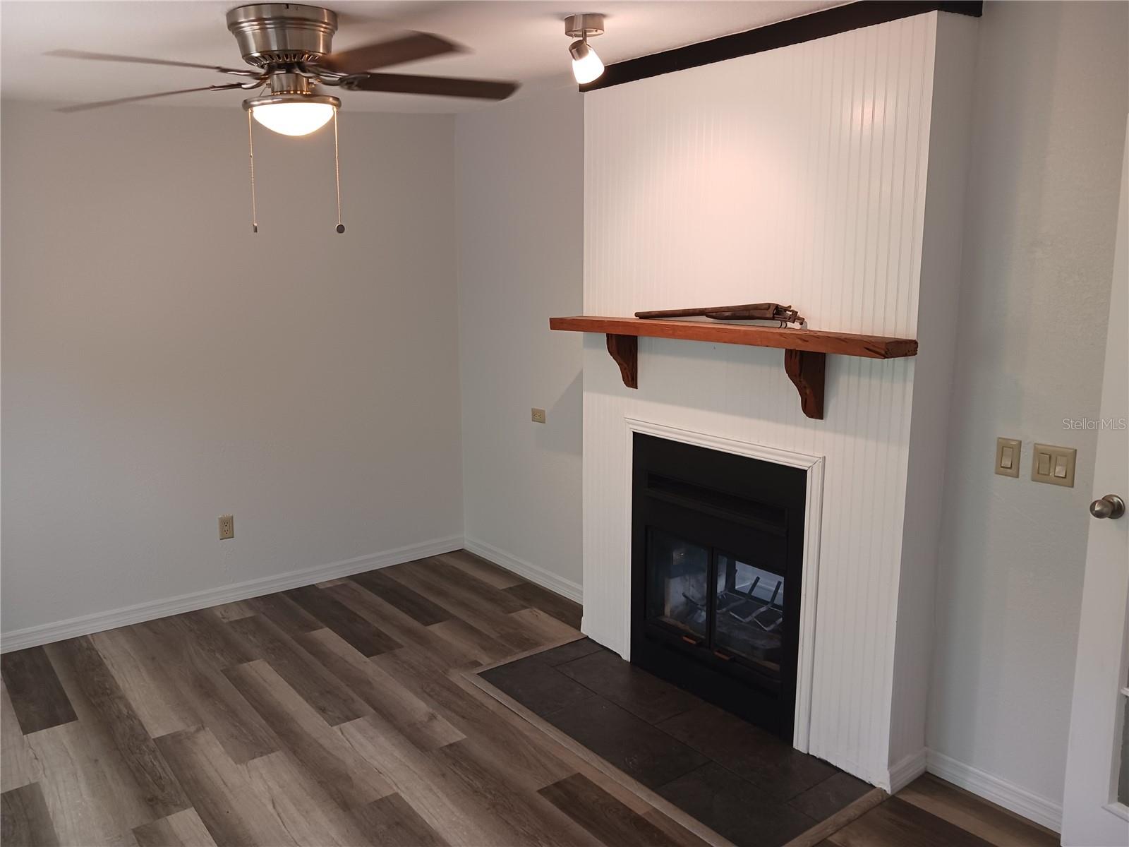 Bonus room with two way wood burning fireplace.