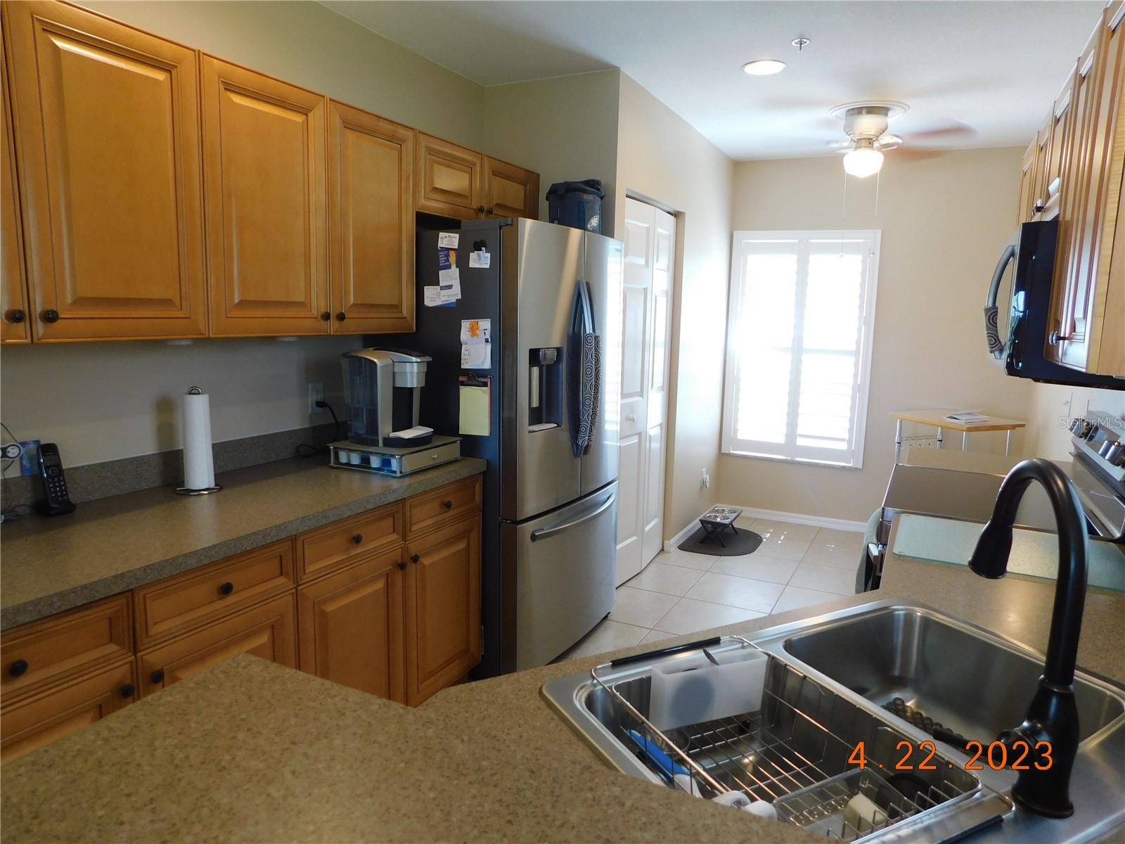 eat-in kitchen with new appliances and wall pantry