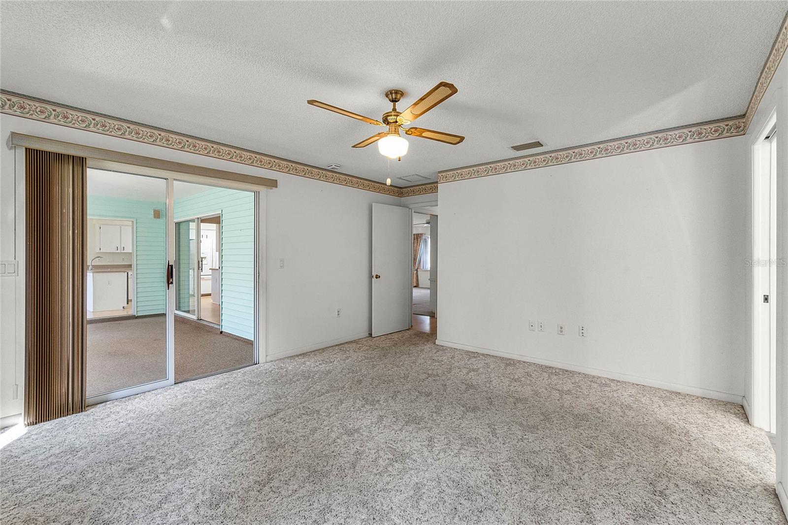 Master Suite offers direct access (sliding glass door) to the Florida Room.