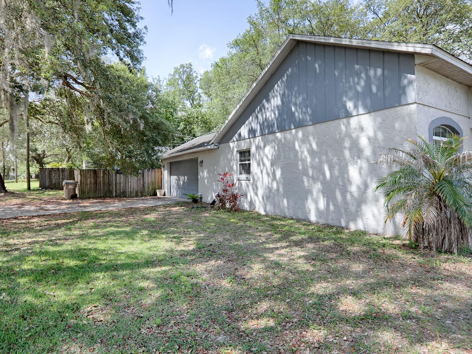 SIDE VIEW OF HOME AND GARAGE