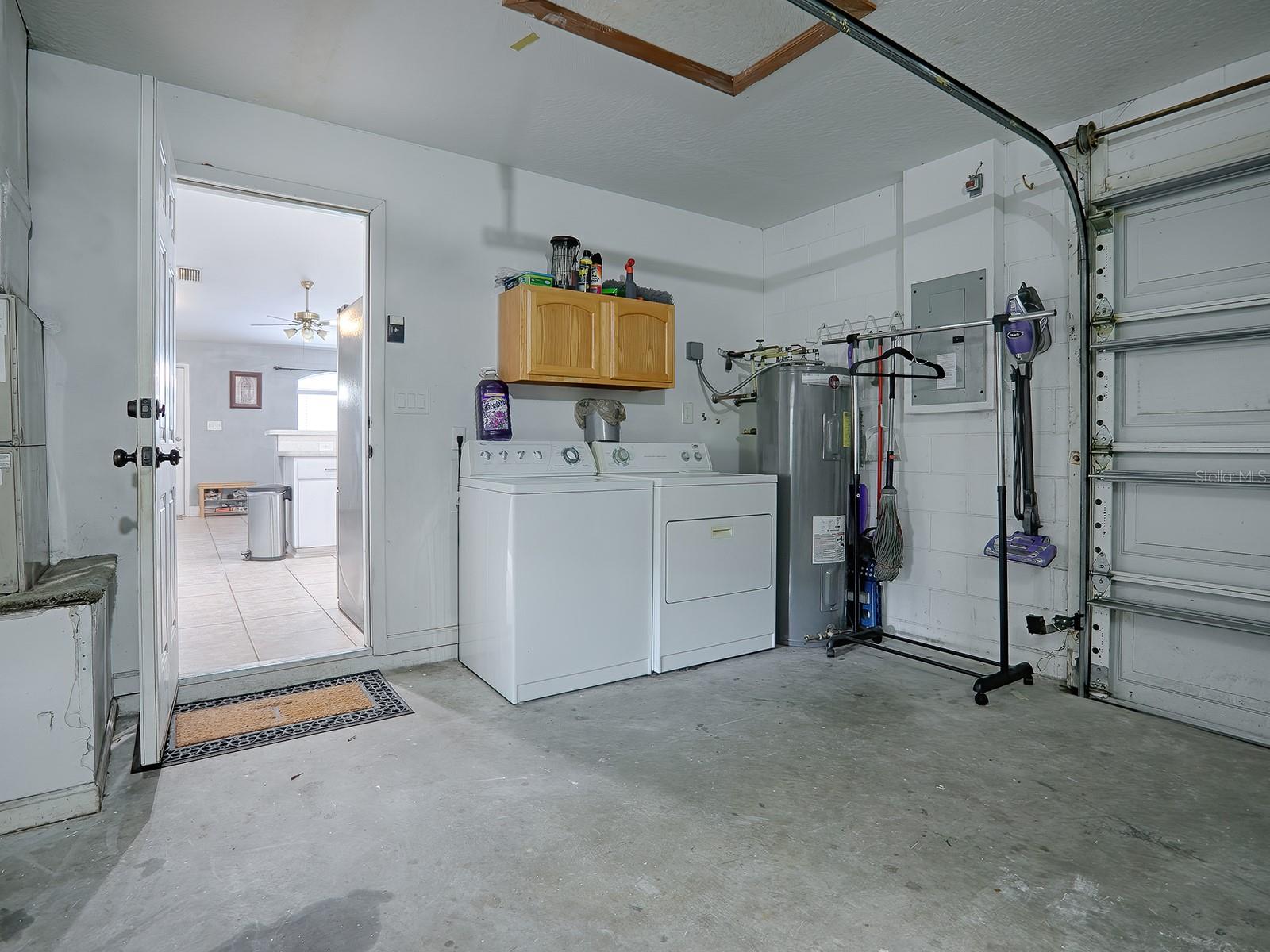 GARAGE VIEW OF WASHER DRYER AREA