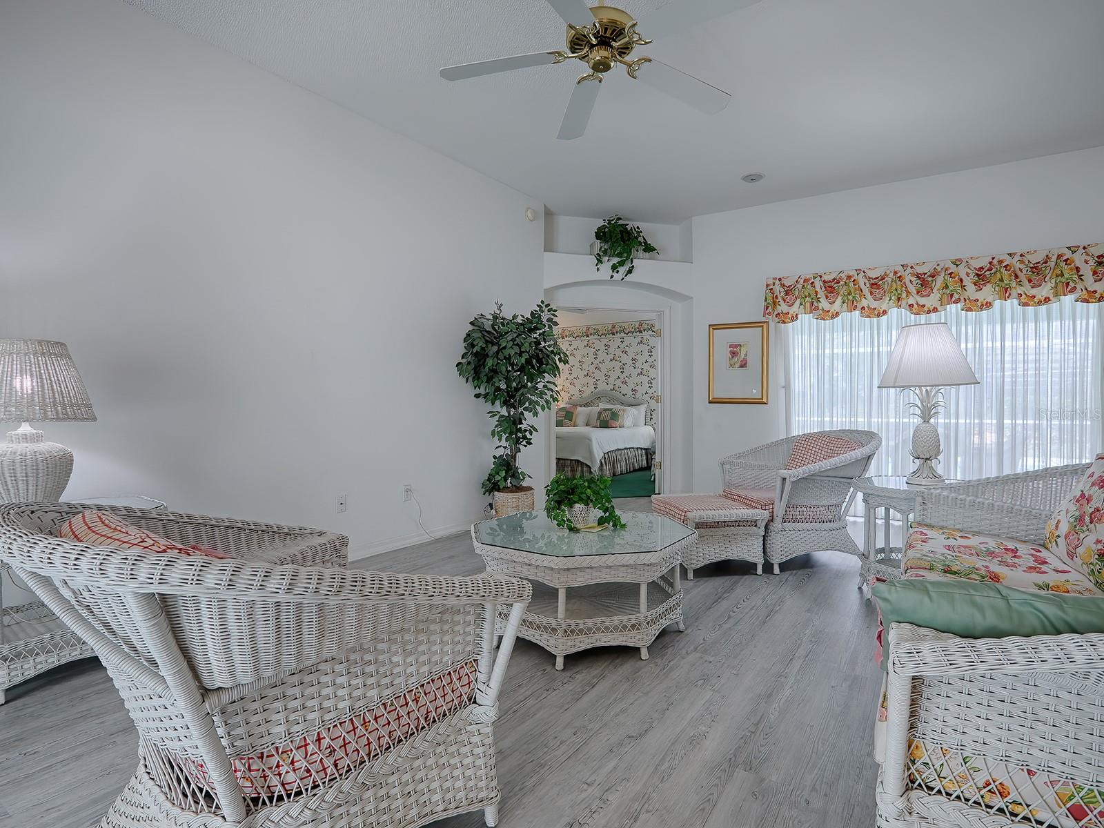 DOORWAY IN THE BACKGROUND HAS FRENCH DOORS THAT LEAD TO THE MASTER BEDROOM.