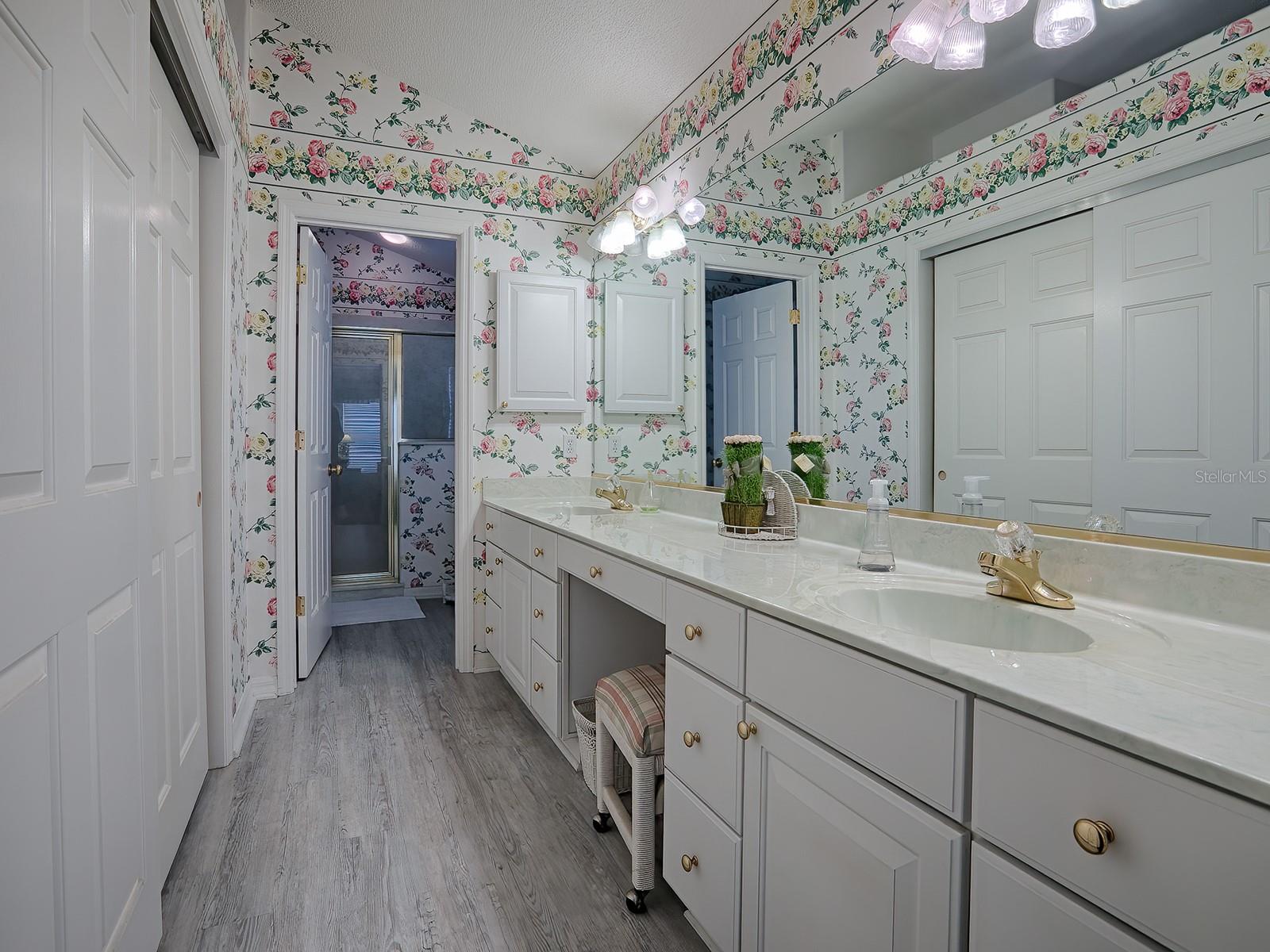 MASTER BATHROOM HAS A LARGE CULTURED MARBLE COUNTER WITH DUAL SINKS AND A VANITY AREA.  THE LARGE WALK-IN CLOSET IS ON THE LEFT AND STRAIGHT AHEAD IS YOUR SEPARATE TOILET AND SHOWER AREA.