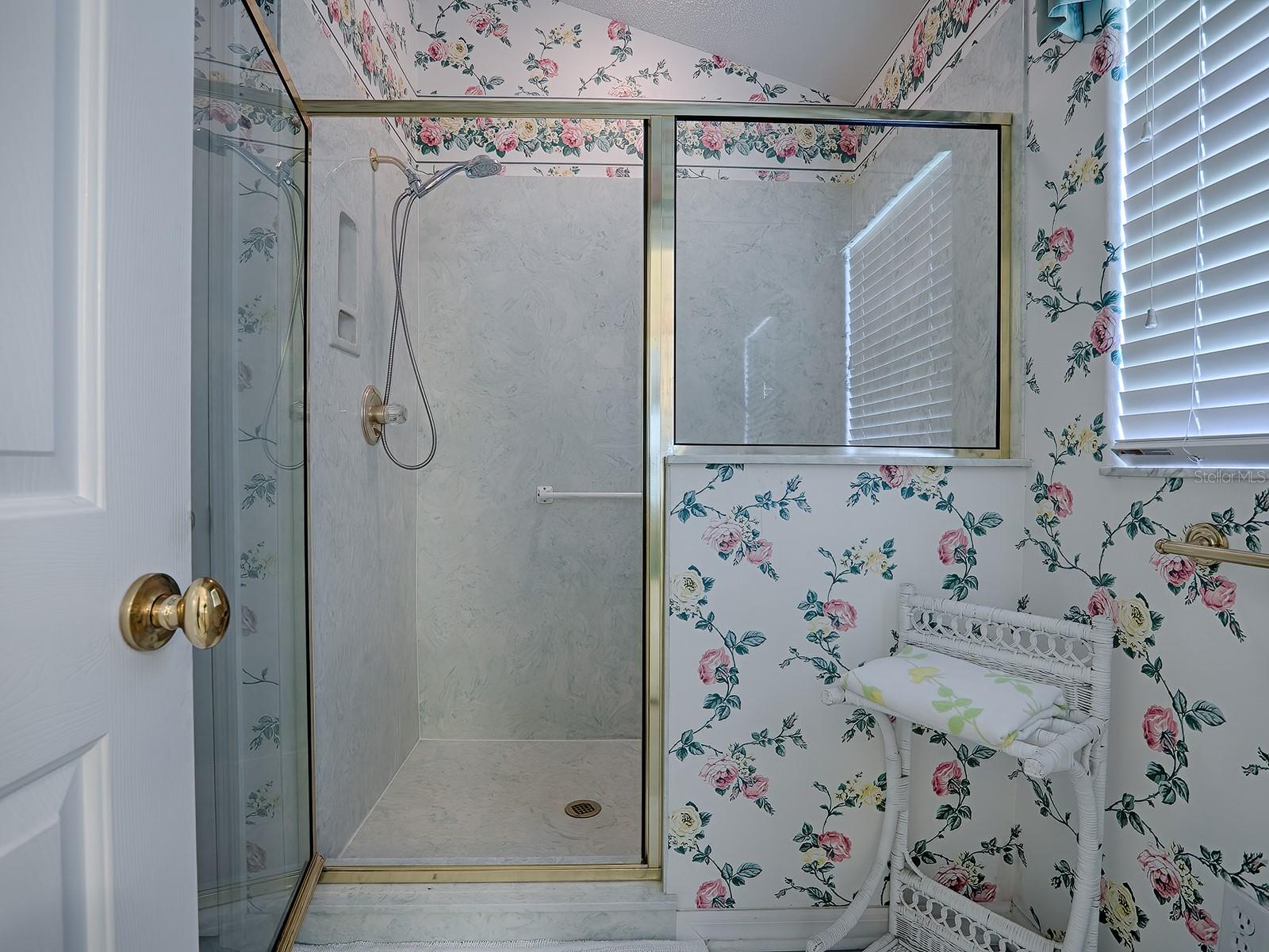 SEPARATE TOILET AND SHOWER ROOM WITH WINDOW FOR NATURAL LIGHT.