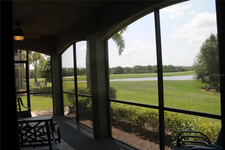 Screened in lanai over looking the green belt, lake and golf course