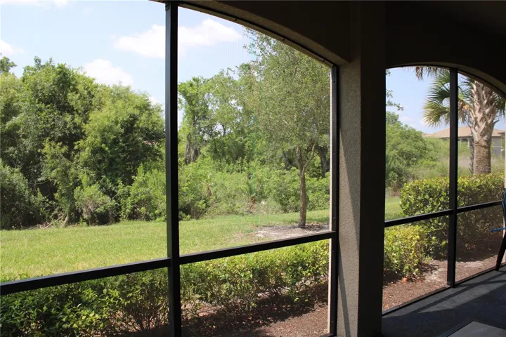 Screened in lanai over looking the green belt, lake and golf course