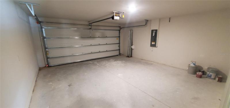 Garage w/opener and stored hurricane shutters