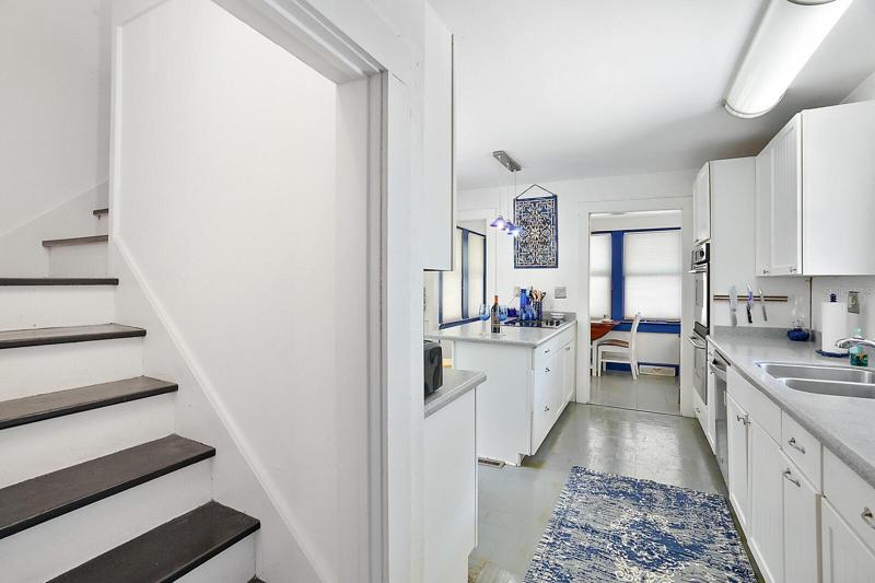 Entry to the kitchen and back stairwell which leads to upstairs bonus room.
