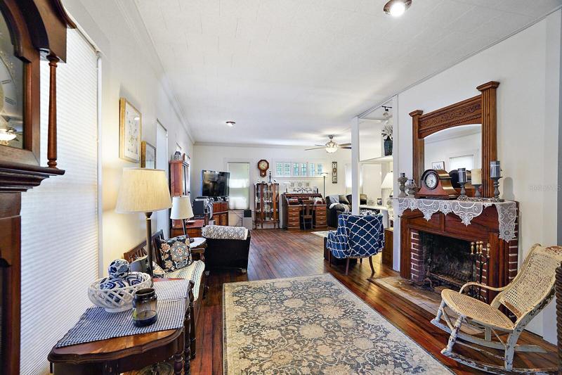 Fireplace in living room with hardwood floors