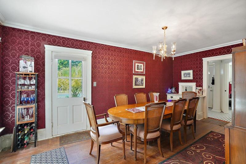 Formal Dining Room with Crown Molding and Wood Floors