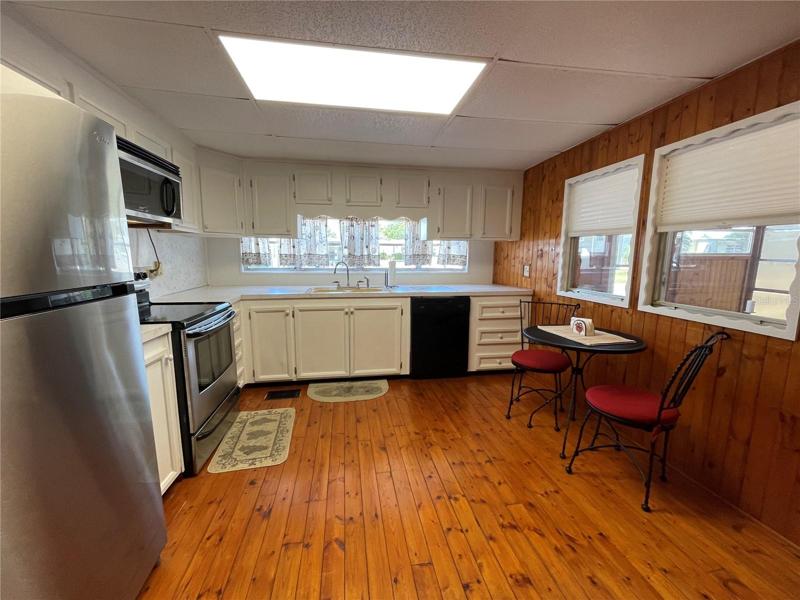 Kitchen w/ lots of cabinets.