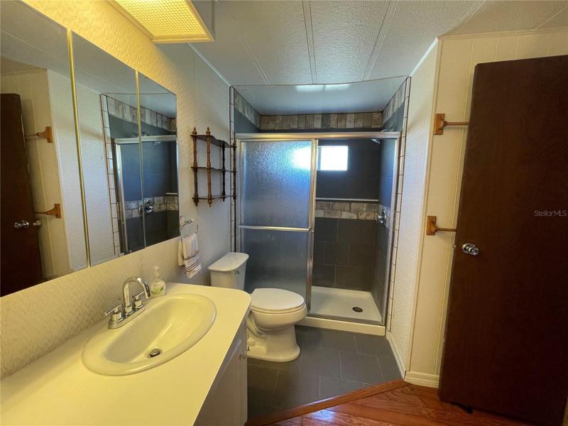 Jack n Jill Bathroom with tile walk in shower.