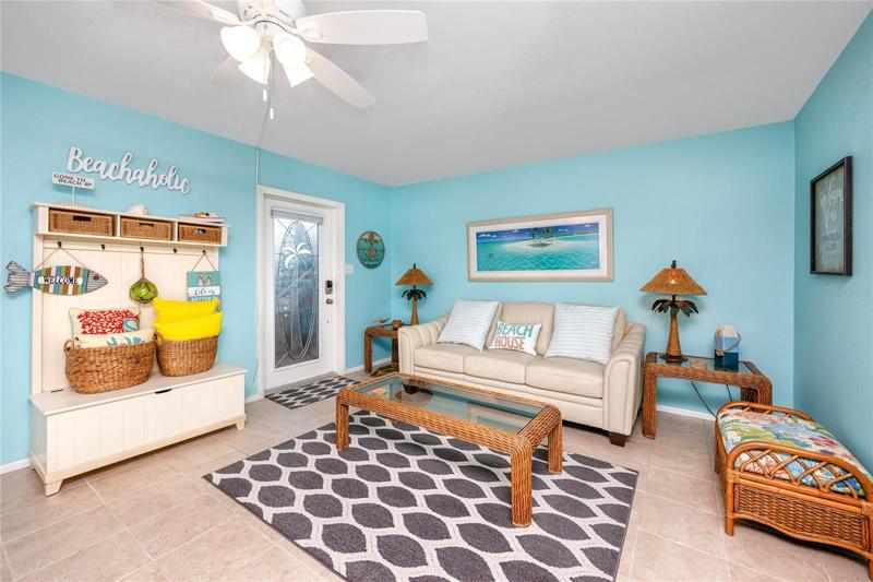 Living room with the front door.
