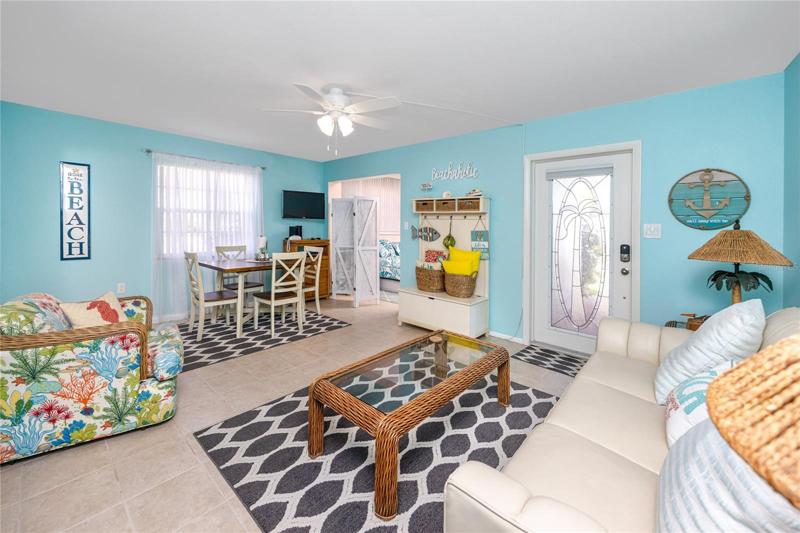 Living room with entrance to the bonus room.