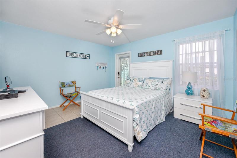 Master bedroom with the backdoor.