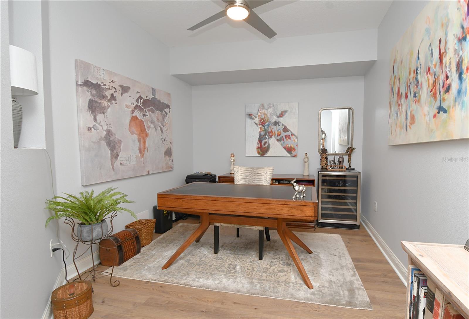 A ceiling fan and a neutral color palette leave a blank canvas to make this room your own.