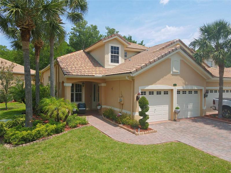 Welcome to this sanctuary of tropical tranquility, this impeccably maintained 3-bedroom, 2.5-bath home with an office in the gated community of The Sabal at Wyndtree in the heart of Trinity.