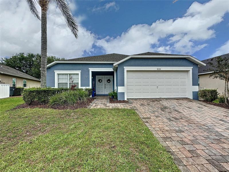 Exterior -fresh paint 2022, double doors and paver driveway