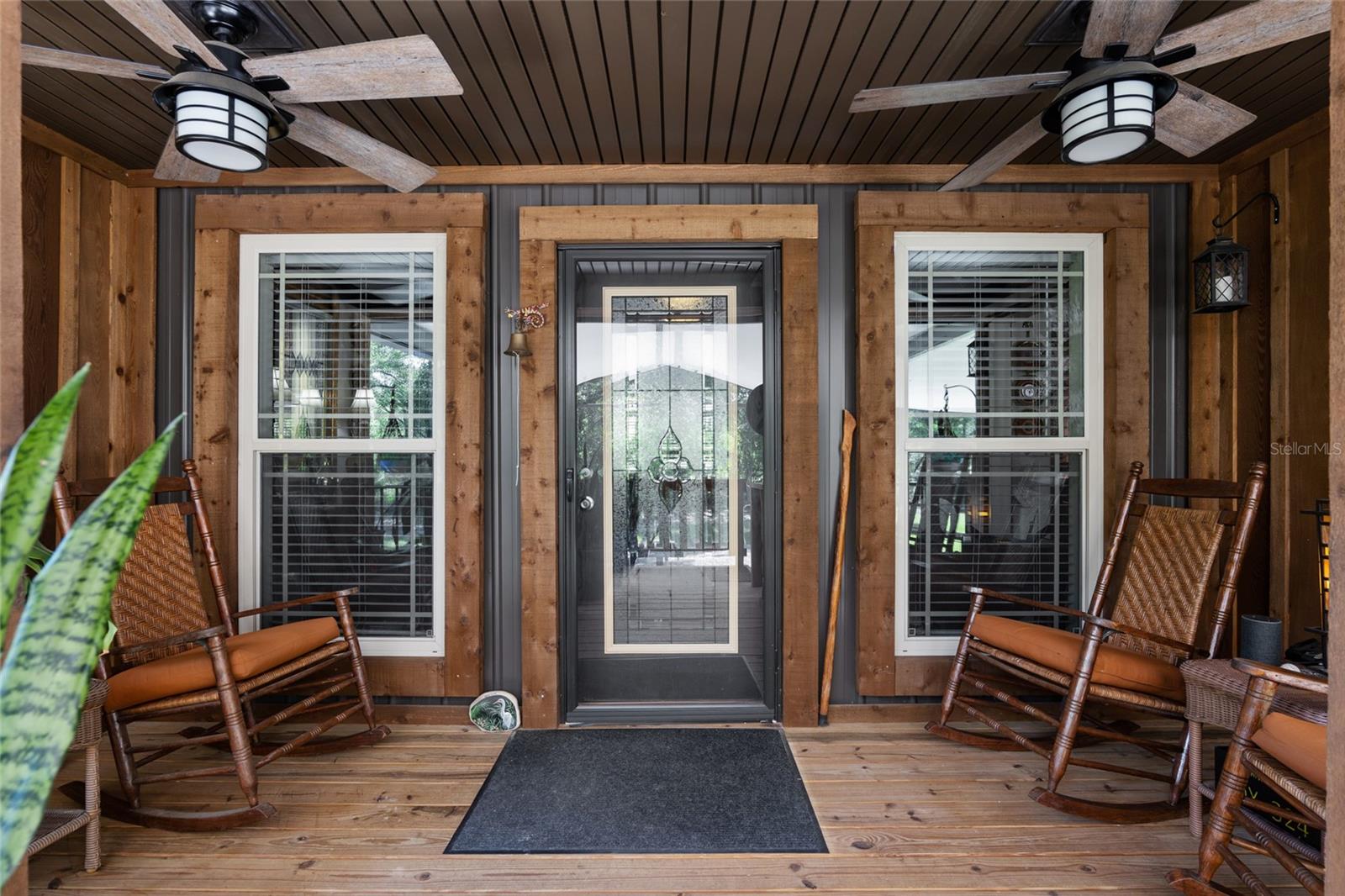 Beautiful front porch and front door with outdoor ceiling fans