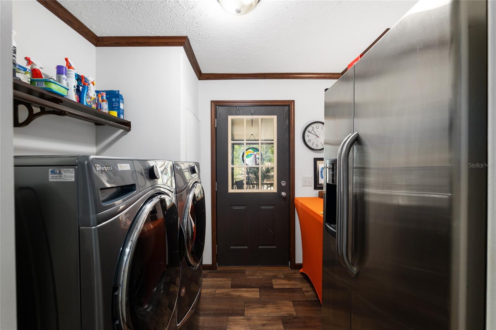 Laundry room with washer, dryer and refrigerator