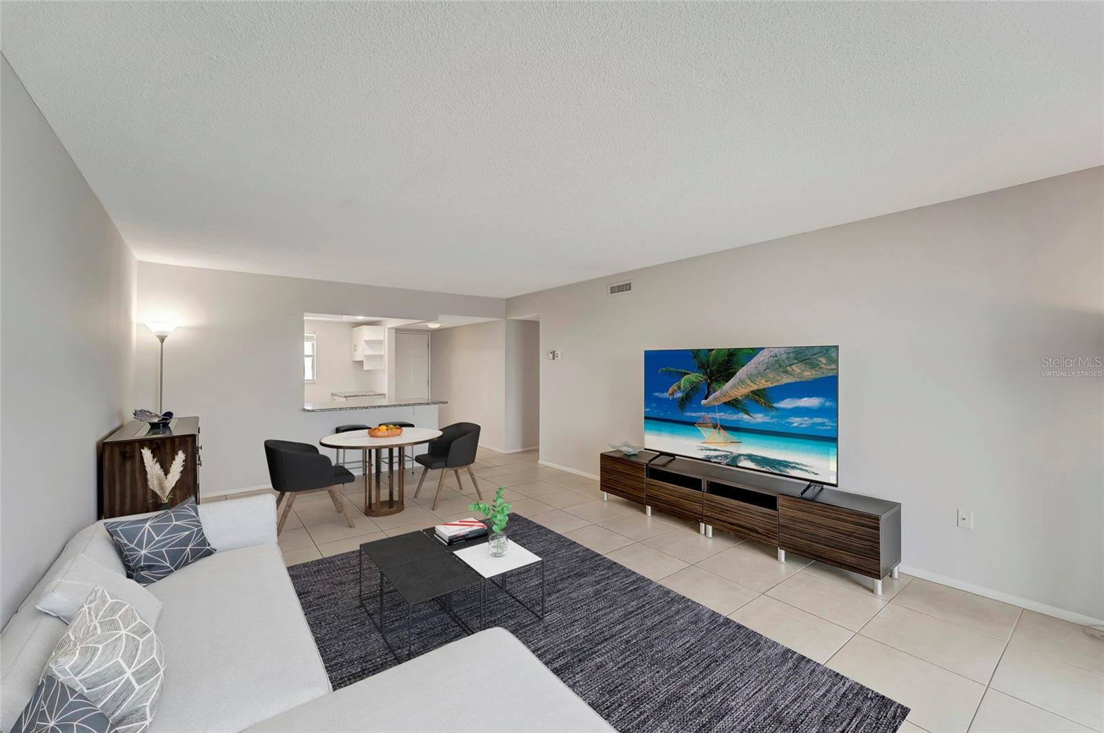 Virtually staged living and dining area