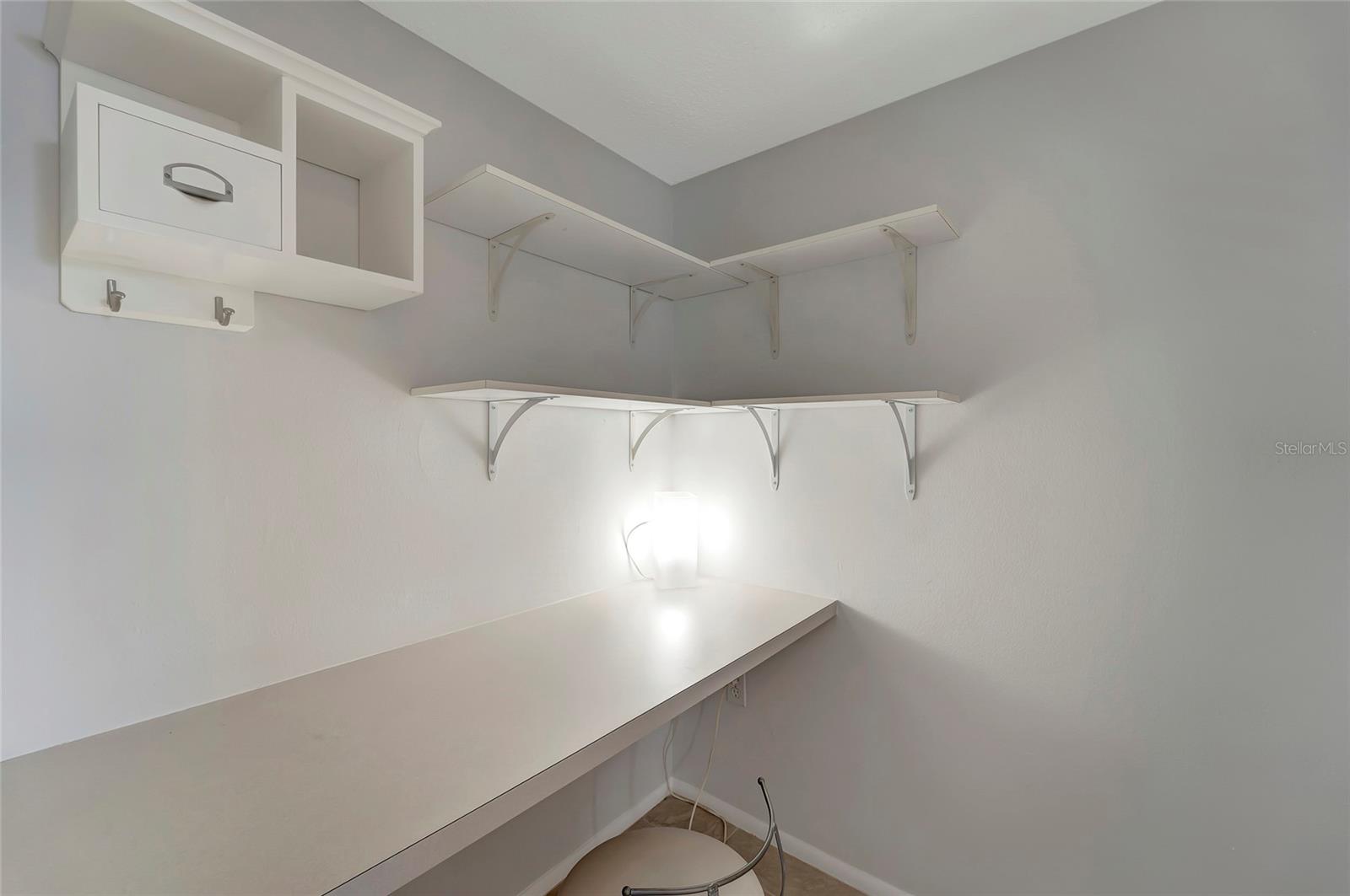 Primary bedroom provides a work space with desk