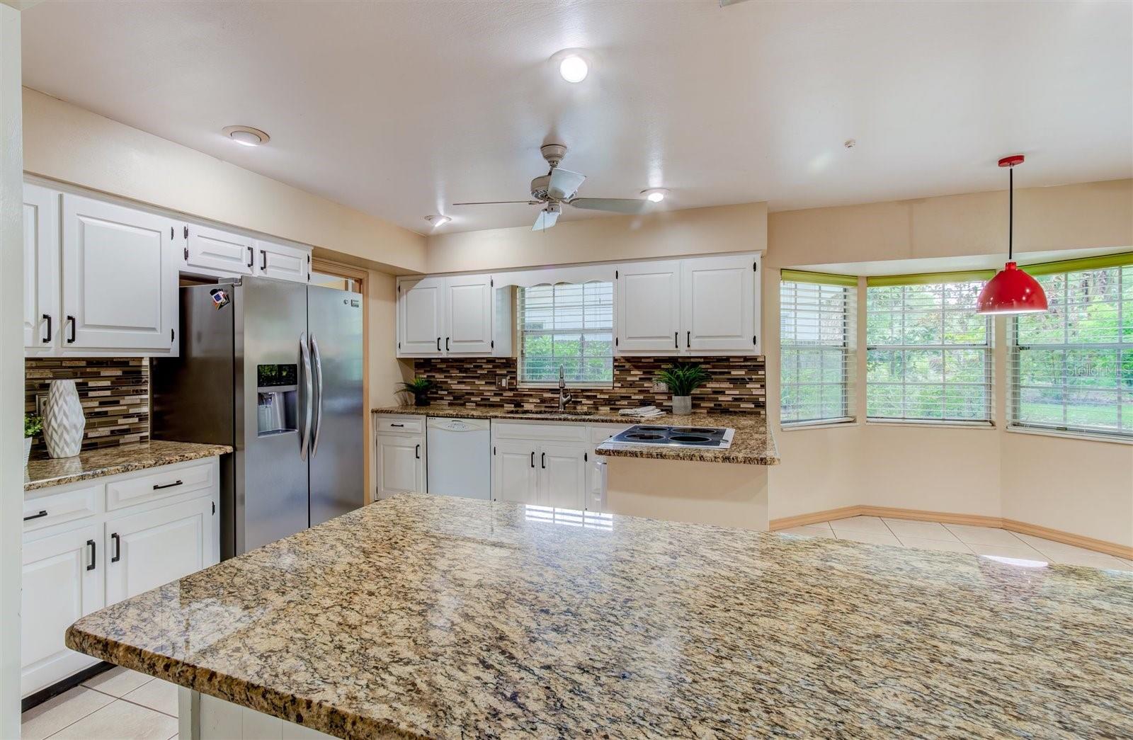 Kitchen with Granite Counters and Abundant Cabinetry