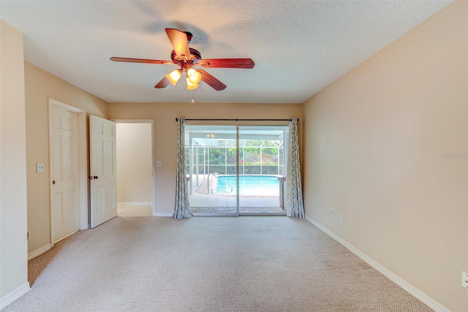 Bedroom #4 with Sliders to the Pool