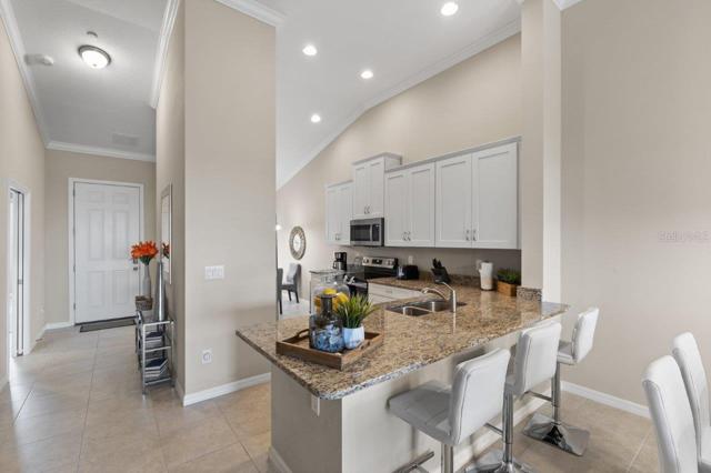 Stunning Kitchen off the front entryway featuring 12'+ Cathedral Ceilings