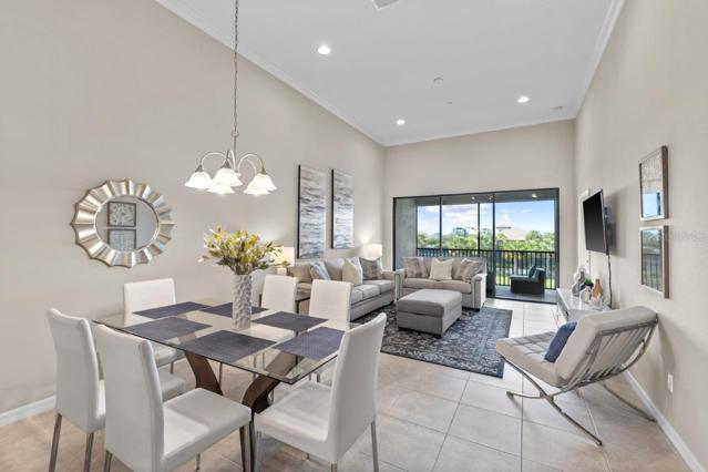 Open floorplan featuring 12'+ Ceilings throughout the spacious dining room and living room with a lakeview