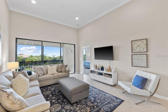 Large living room with lake views featuring 12'+ Ceilings
