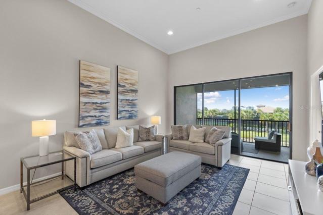 Large living room with lake views featuring 12'+ Ceilings