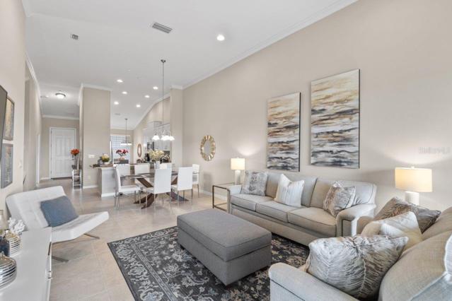 Large living room with lake views featuring 12'+ Ceilings