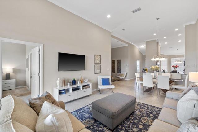 Large living room with lake views featuring 12'+ Ceilings