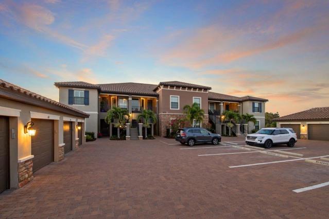 Front Exposure showing one car garage and private parking