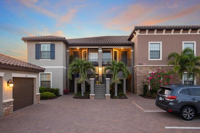 Front Exposure showing one car garage and private parking